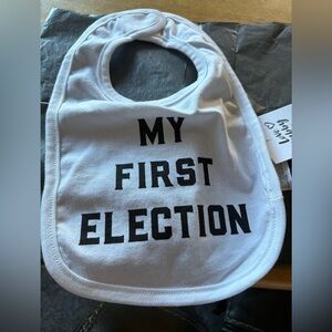 Brand-new WITH TAGS never-used baby bib! Available at just the right time.